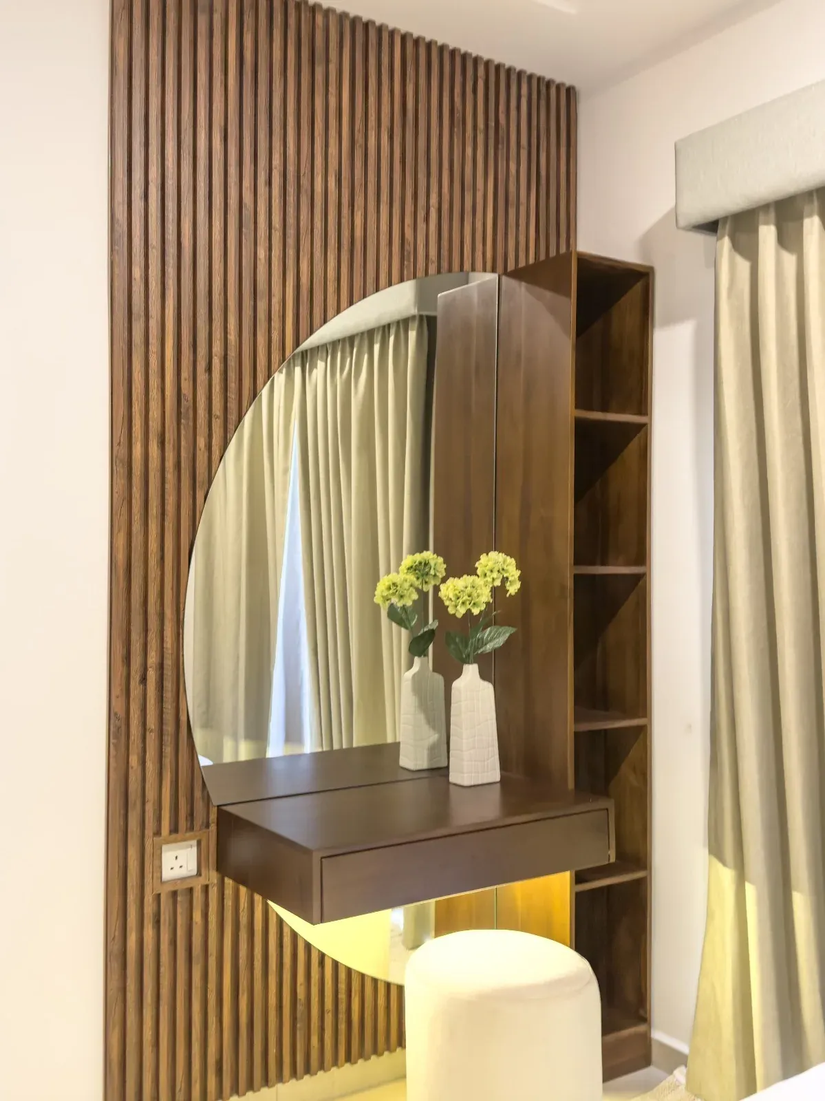 Fluted timber dressing unit with a round mirror and floating shelf