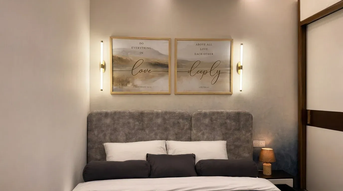 Wide view of the master bedroom headboard wall with twin wall lights